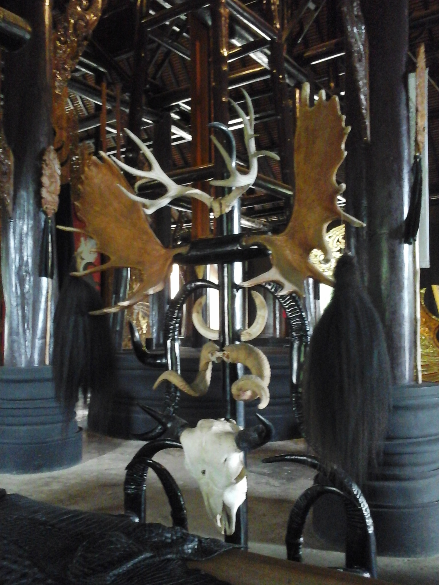 Another view of the horned chairs with skull at Baan Daam
